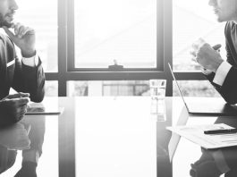 board members talking - black and white
